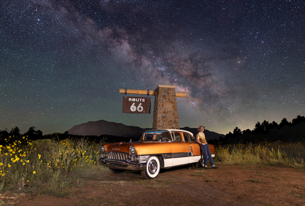 Posing with a classic car and Route 66 sign on a starry night in Flagstaff, Arizona