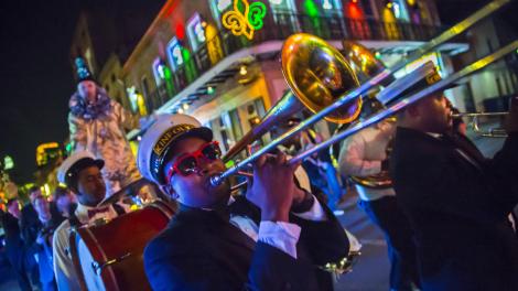 Brass band parading through the French Quarter