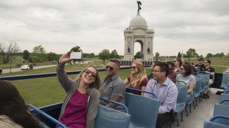 Touring Gettysburg National Military Park in Pennsylvania via open-air bus