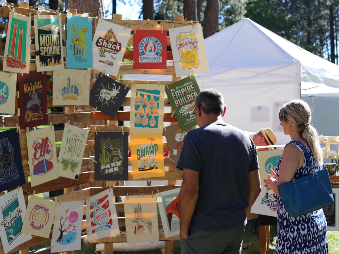 Browsing artists’ booths at ArtFest Spokane