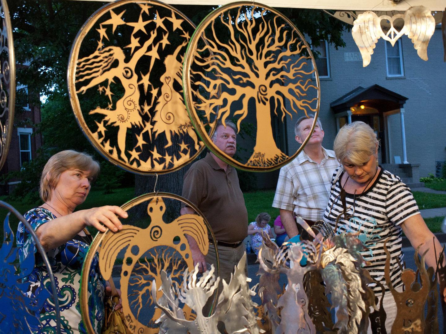 Browsing the artwork at Lower Town Arts & Music Festival