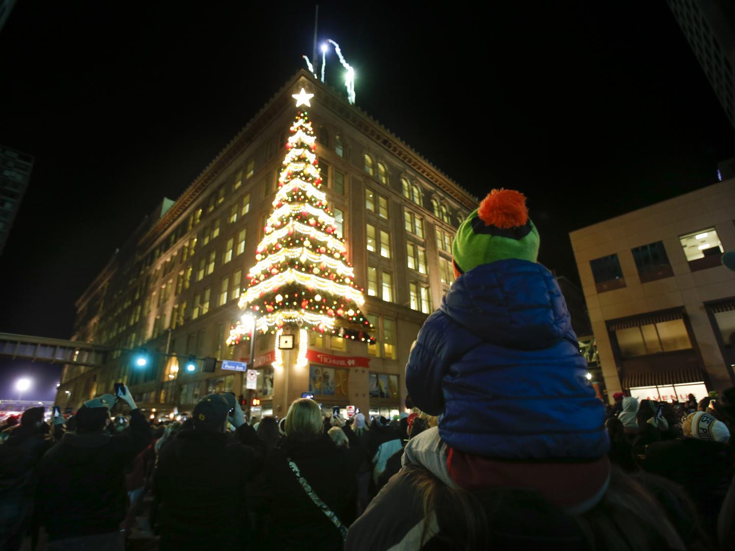 A Christmas tree decoration on the side of a building during Light Up Night in Pittsburgh, Pennsylvania