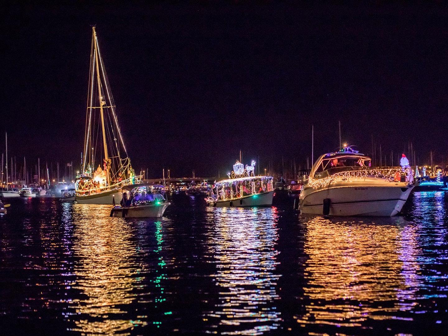 Boats decorated to celebrate the holidays during the Parade of Lights at Channel Islands Harbor in Oxnard, California