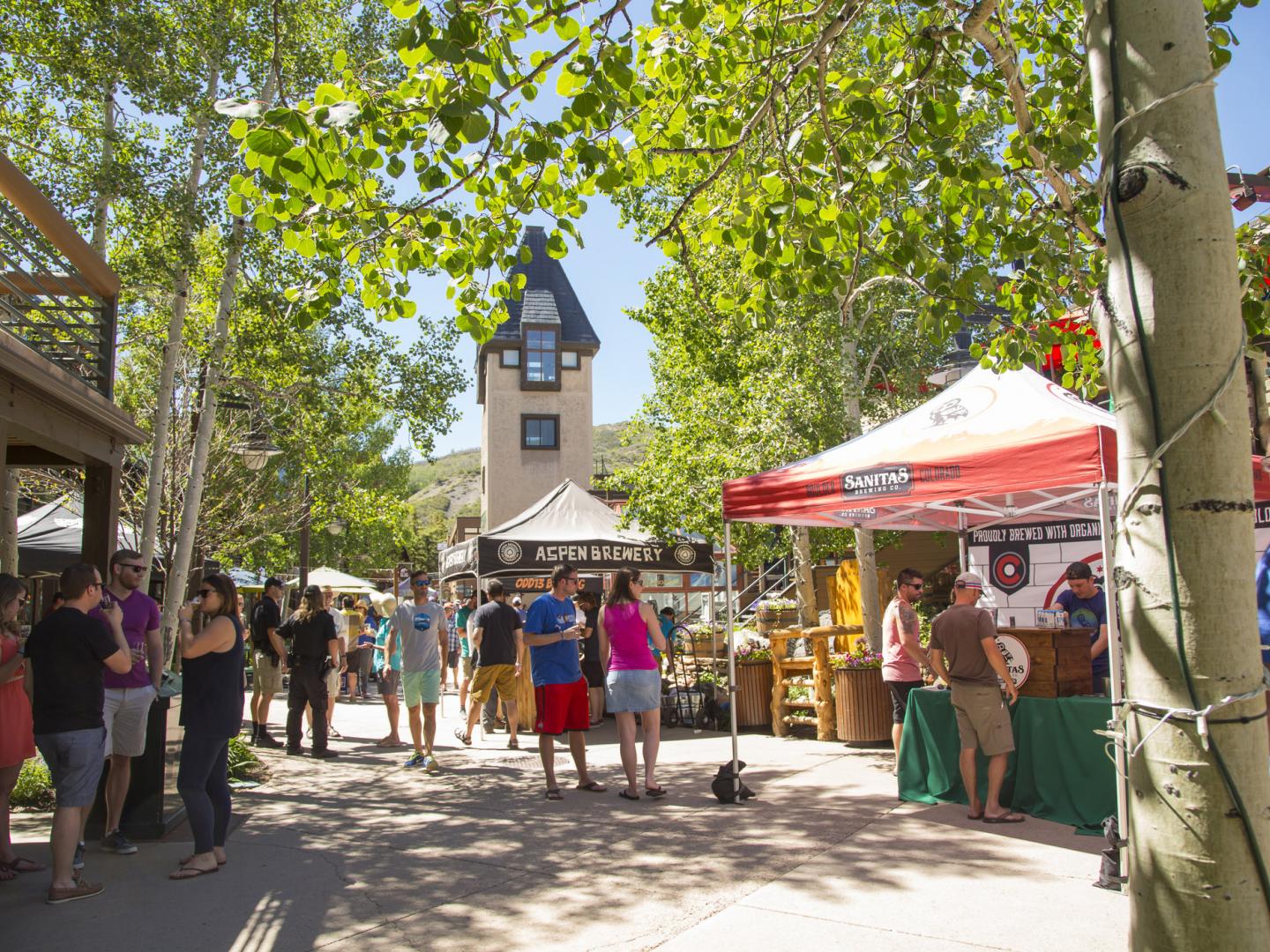 Browsing craft beer tents for tastings at the Snowmass Rendezvous Craft Beer Festival in Colorado
