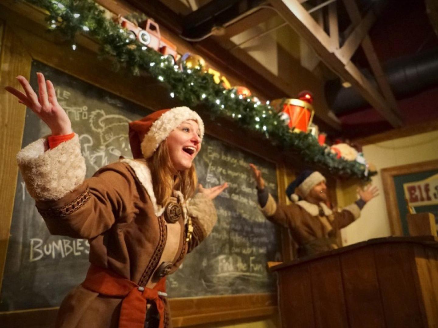 Presenters dressed as elves greet visitors at The North Pole Experience in Flagstaff, Arizona
