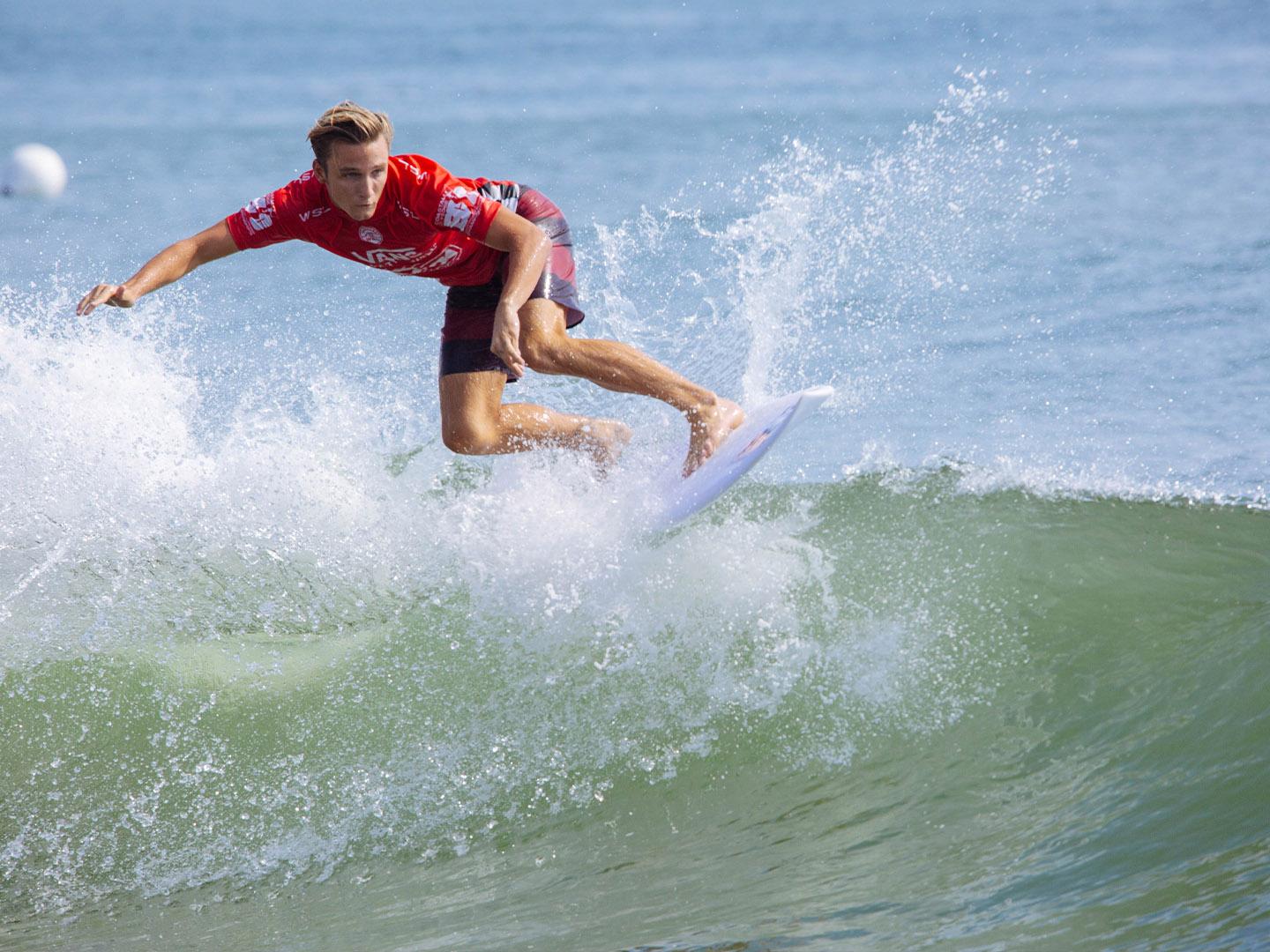 A surfer competes in the Coastal Edge East Coast Surfing Championships in Virginia Beach, Virginia