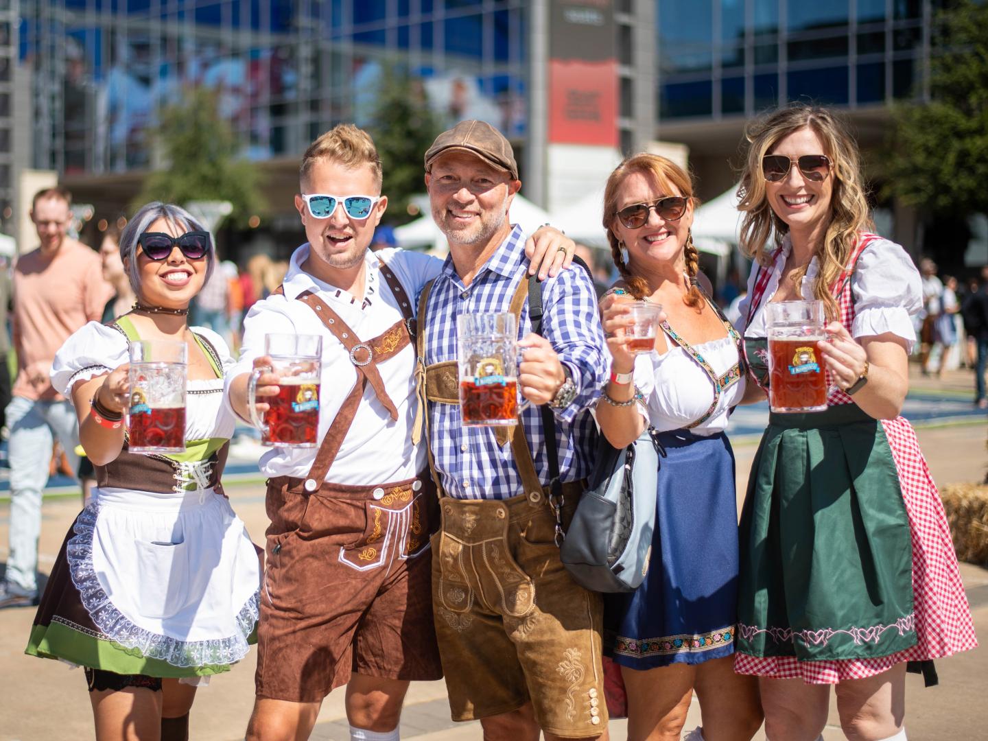Attendees in festive costume at Frisco Oktoberfest in Texas