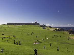 Flying kites on a sunny day at the El Morro Fort Flying kites on a sunny day at the El Morro Fort