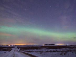 The northern lights, or aurora borealis, illuminate the winter night sky The northern lights, or aurora borealis, illuminate the winter night sky