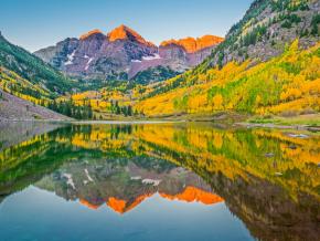 The autumn sun sets the Maroon Bells ablaze