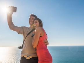 Couple taking a selfie in front of Lake Michigan
