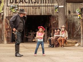 A girl poses with Knott’s Ghost Town Sheriff after rounding up some bandits A girl poses with Knott’s Ghost Town Sheriff after rounding up some bandits