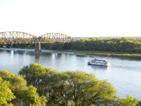 A riverboat glides down the Missouri River A riverboat glides down the Missouri River
