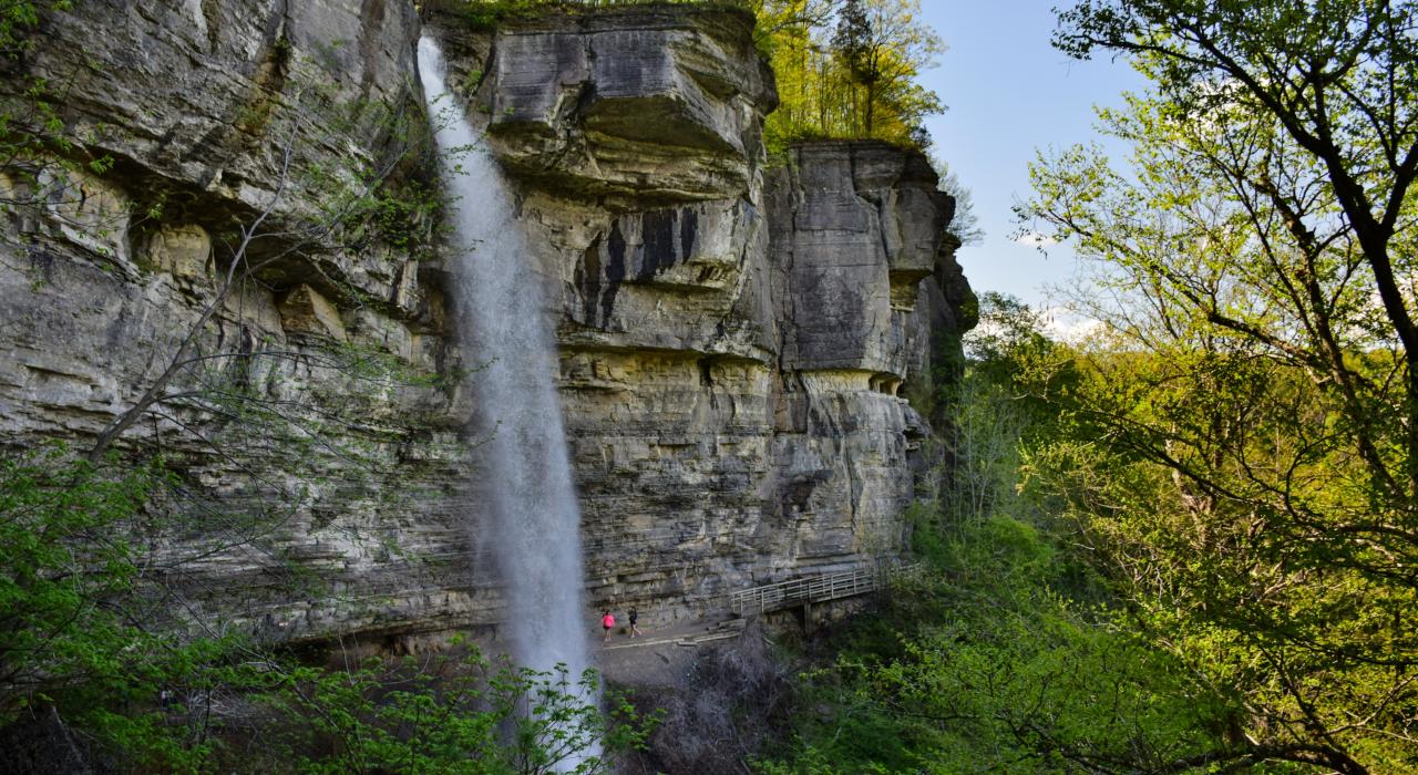 Hiking to a waterfall on the Indian Ladder Trail in John Boyd Thacher State Park