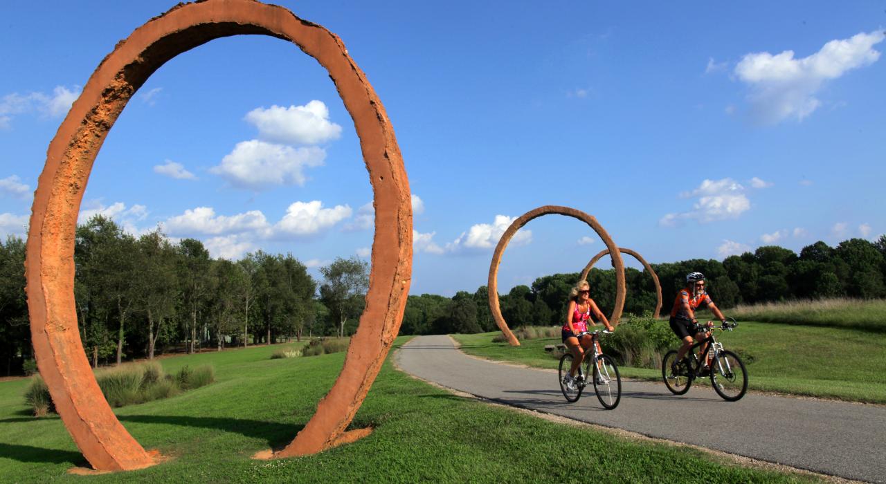 Biking alongside sculptures in the North Carolina Museum of Art’s sprawling Museum Park