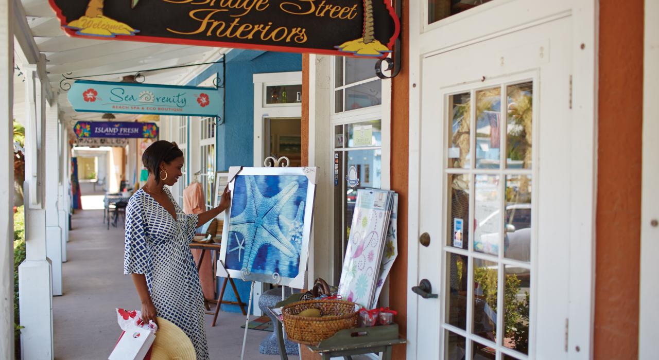 Woman browsing the shops on Bridge Street in Bradenton Beach