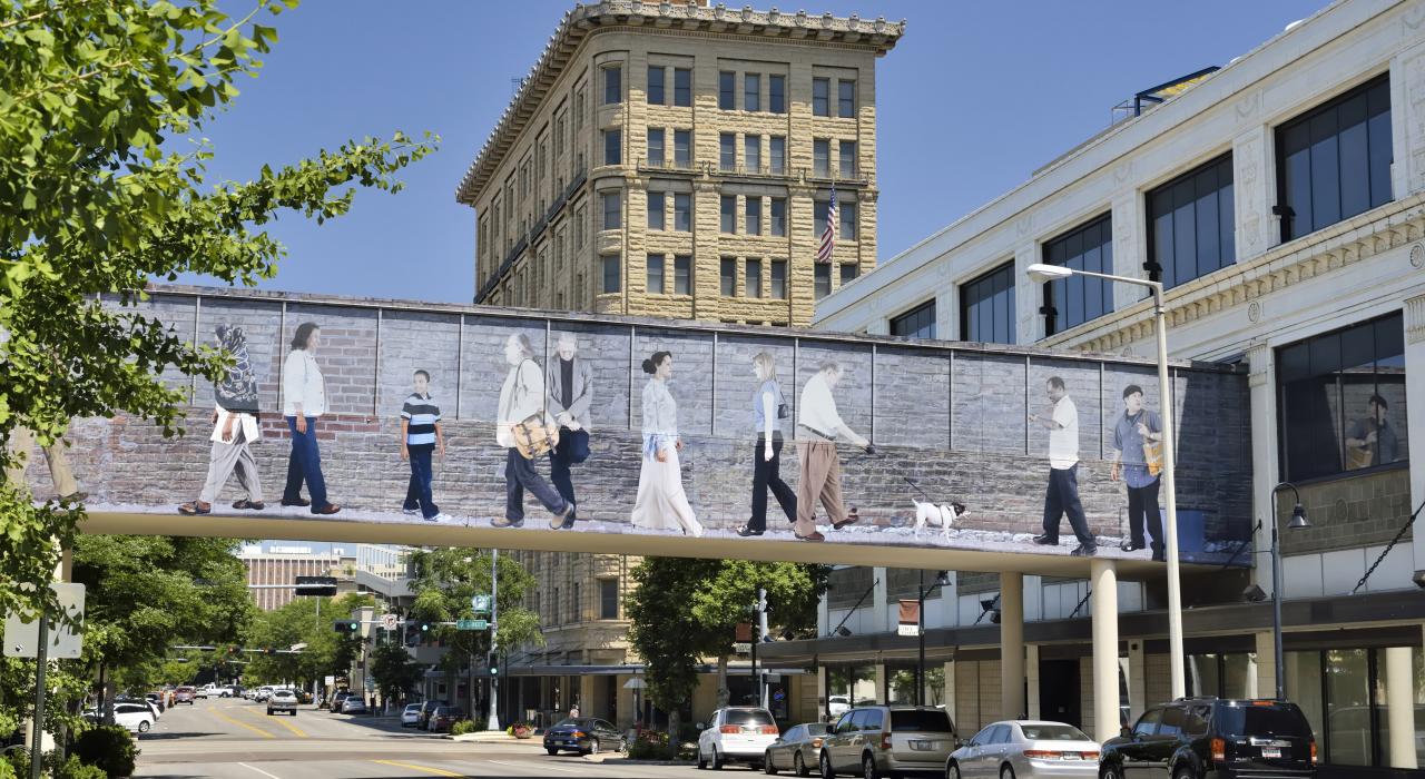 Colorful pedestrian bridge crossing a downtown street