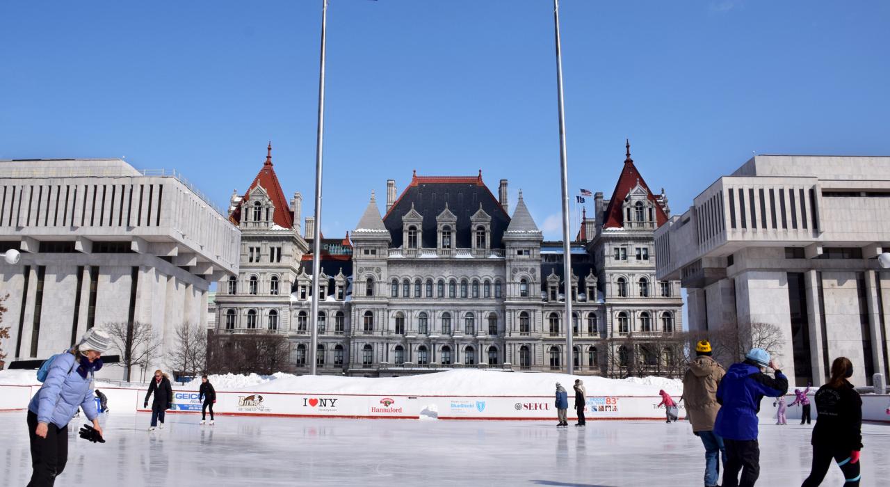 Ice skating at the Empire State Plaza with views of the New York State Capitol Building