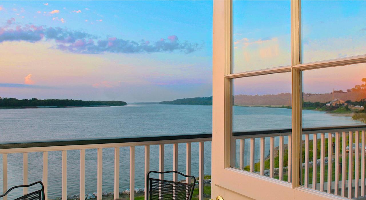 A tranquil balcony view from the River Edge Suites in the historic “Under-the-Hill” district